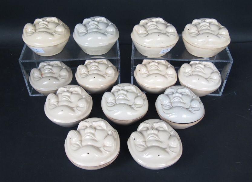 Thirteen Ceramic Face Molds