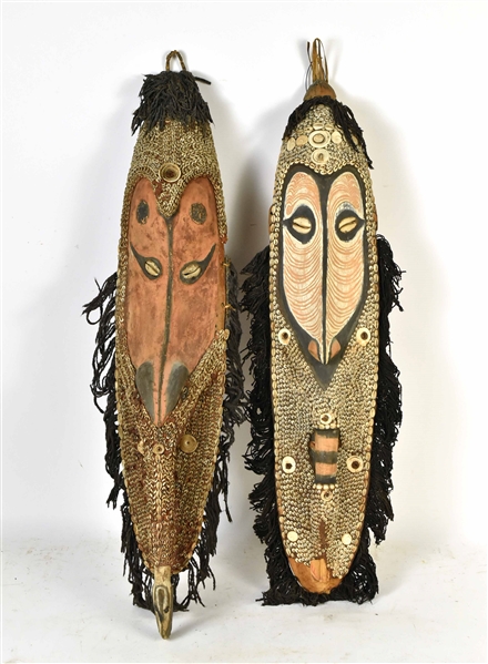 Two Similar Shell-Decorated Painted Wood Masks