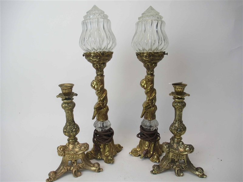 Pair of Putti-Form Patinated Metal Candlesticks