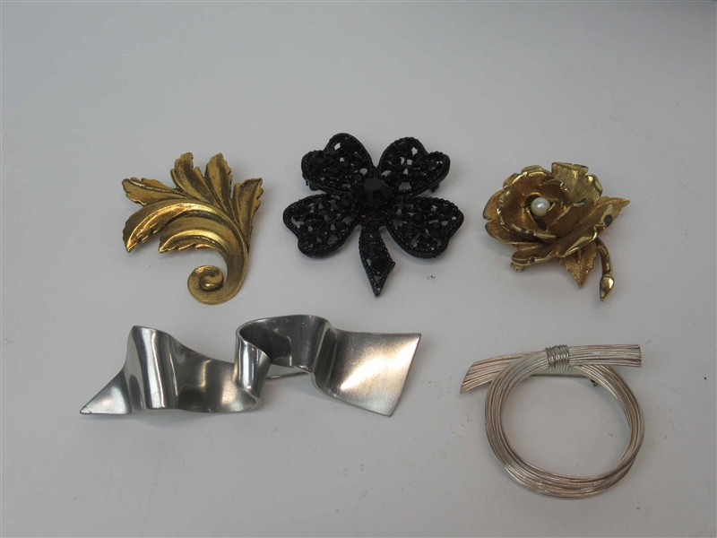 Five Large Brooches