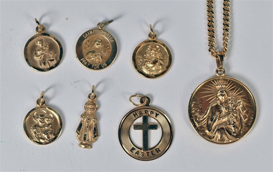 Seven 14K Yellow Gold Religious Medals With Chain