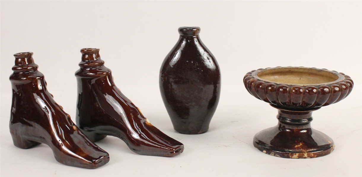 Two Rockingham Pottery Shoe Form Flasks