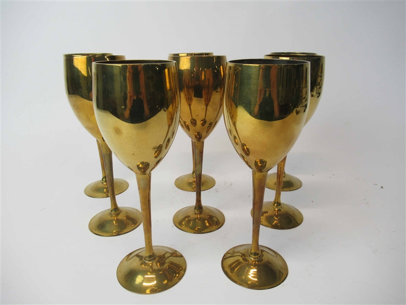 Eight Brass Wine Glasses