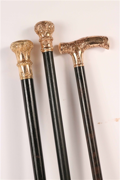 Three Gold Mounted and Wood Canes