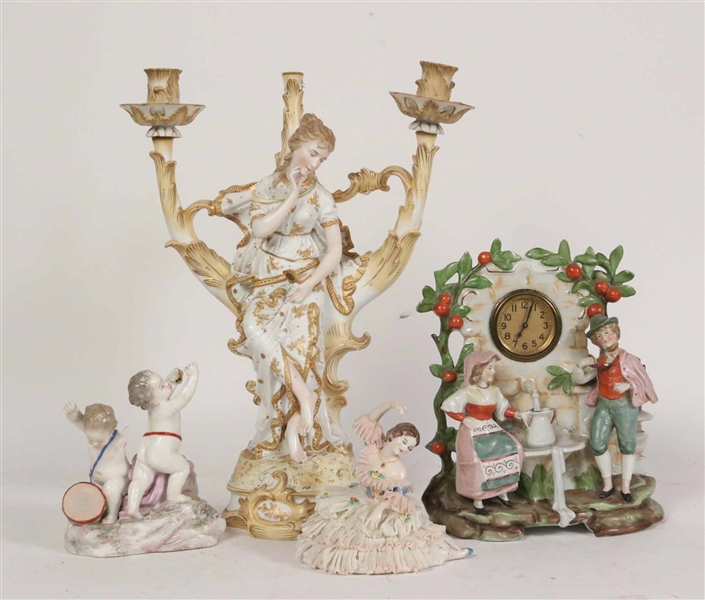 Four Porcelain Figural Table Articles