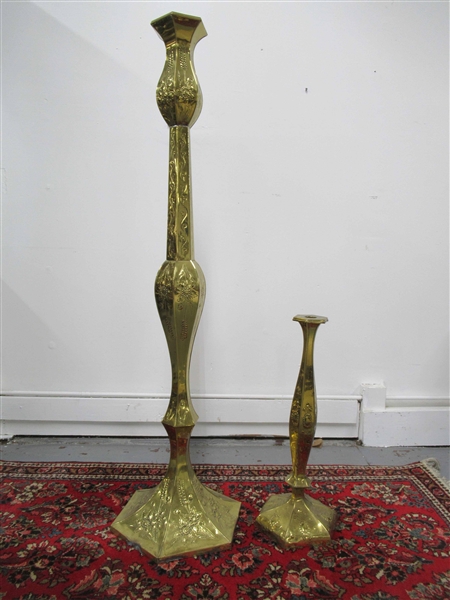 Two Large Brass Embossed Floor Candlesticks