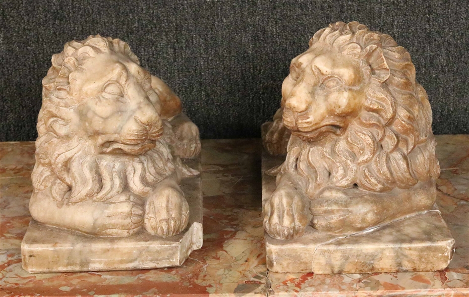 Pair of Carved Marble Recumbent Lions