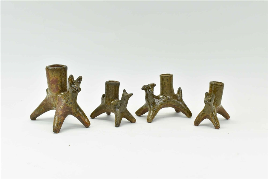 Four Figural Pottery Candle Holders