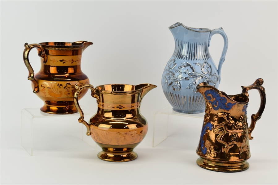 Group of Four Lusterware Pitchers