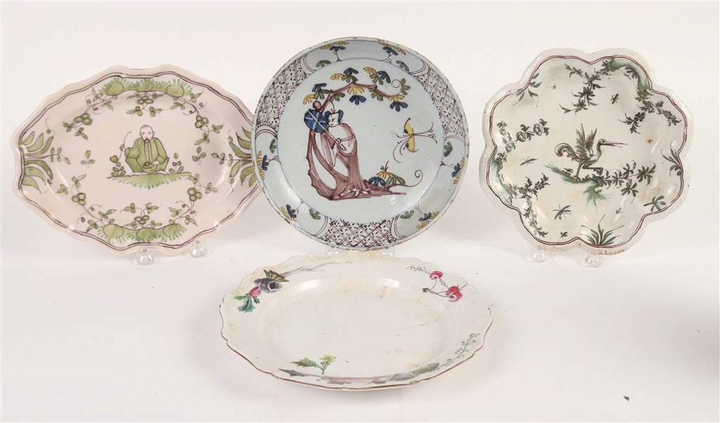 Four Tin Glazed Earthenware Plates