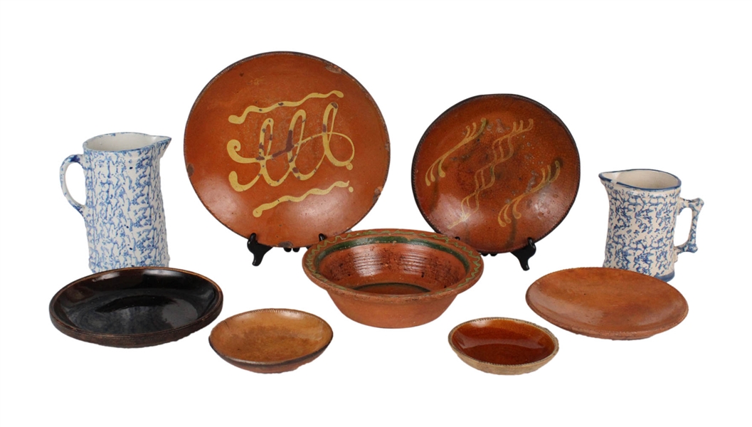 Seven Slip-Decorated Redware Plates and Bowls